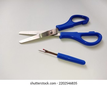 Fabric Scissors, Seam Ripper Isolated On A White Background