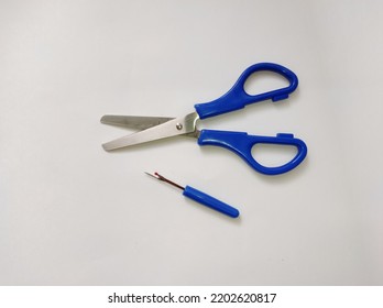 Fabric Scissors, Seam Ripper Isolated On A White Background