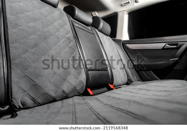 fabric seat cover\
in a car in a black\
interior