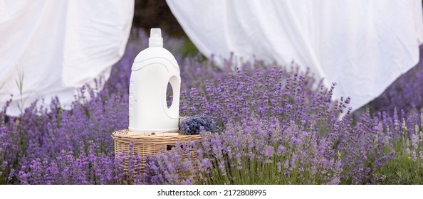 Fabric Softener With Lavender Scent. Fragrance In A Field With Purple Flowers.