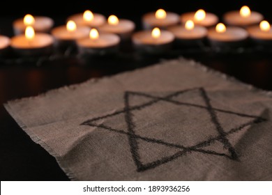 Fabric with star of David on black background. Holocaust memory day