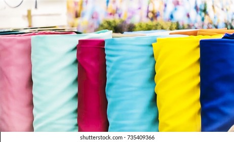 Fabric Store, Traditional Fabric Store With Stacks Of Colorful Textiles, Fabric Rolls At Market Stall - Textile Industry Background With Blurred.
