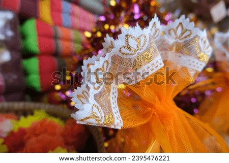Fabric texture of alms flowers bag in Kathina Ceremony. 