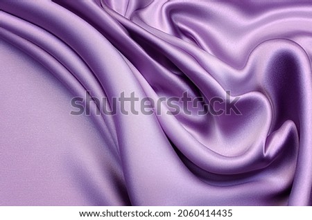 Fabric texture, background for design. Texture of puple silk or cotton or wool fabric. Beautiful pattern of waven fabric.