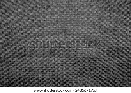 The fabric texture from the dark gray sofa is used for the background and texture design