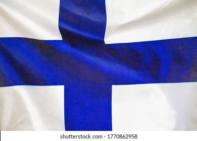 Fabric Texture Flag Of Finland. Flag Of Finland Waving In The Wind. Finland Flag Is Depicted On A Sports Cloth Fabric With Many Folds. Sport Team Banner