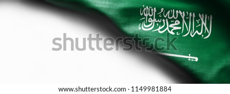 Fabric texture flag of Saudi Arabia on white background