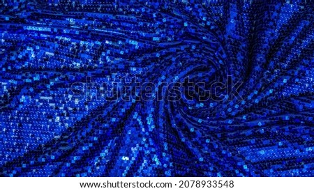 Fabric texture with spangles. Background sequin. Glitter texture. Fabric sequins. Blue sequins pattern. Abstract background.