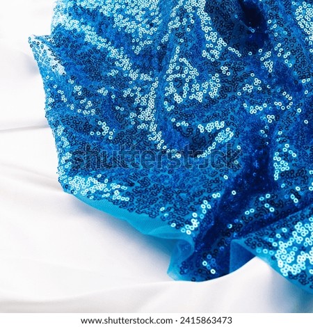 Fabric texture with spangles. Background sequin. Glitter texture. Fabric sequins. Iron cloth. Blue sequins pattern. Abstract background.