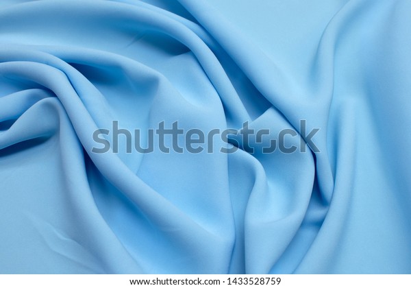 Fabric viscose (rayon). Color is light blue.\
Texture, background,\
pattern.