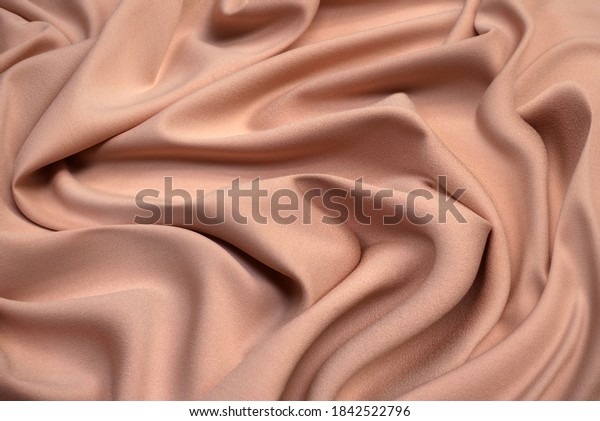 Fabric viscose (rayon). Color is light pink.\
Texture, background,\
pattern.