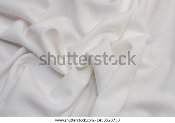 Fabric viscose (rayon). Ivory. Texture,
background, pattern.