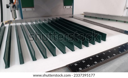 Fabricated of green cleat on pu white conveyor belt by press machine for making inclined conveyor line in food industry
