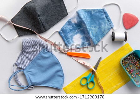 Fabrics and sewing accessories for sewing an anti-virus mask,Homemade facemask against virus infection in detail. Top view