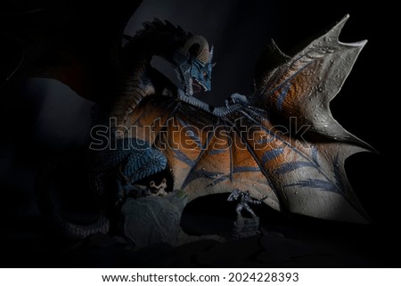 A fabulous confrontation, a majestic, formidable dragon and a small but brave knight