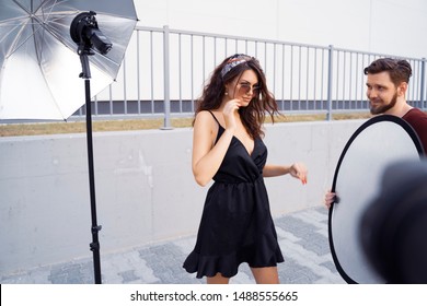 Fabulous Fashion Model On Set, Photo Shoot Outdoors, Cameraman View 