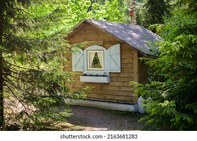 Fabulous Little Wooden House In A Sunny Forest. Hut From A Fairy Tale