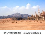 A fabulous lost city in the desert. Fantastic oriental town in the sands. Fantasy landscape with rocky mountains and fairytale city