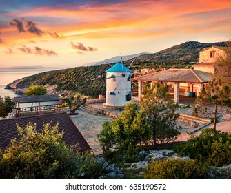 Fabulous morning scene of the countryside with Windmill. Colorful spring sunrise on the Zakynthos island, Korithi location, Ionian Sea, Greece, Europe. Beauty of countryside concept background.
