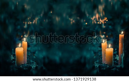 fabulous Night forest and magic candles. mysterious fairy scene. witchcraft ritual. fall season natural Background. Samhain, Halloween holiday concept. copy space