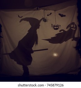 Fabulous Shadow Little Witch With A Broom And A Ghost.The Theatre Of Shadows. . Childhood. A Magical Story.Halloween.