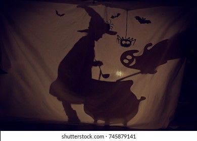 Fabulous Shadow The Little Witch At The Cauldron Brews A Potion With A Ghost.The Theatre Of Shadows. . Childhood. A Magical Story.Halloween.