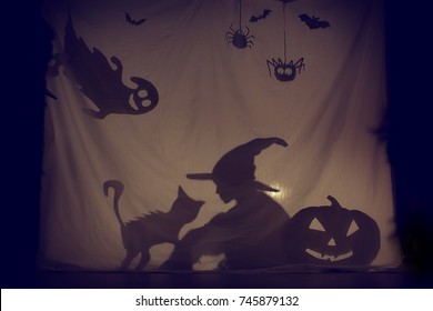 Fabulous Shadow Little Witch Of A Pumpkin With A Cat And A Ghost.The Theatre Of Shadows. . Childhood. A Magical Story. Halloween.