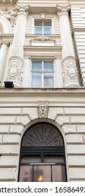 Facade of an ancient building with columns.