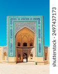 Facade of the ancient Kalyan mosque, a UNESCO World Heritage Site. View through the arch. Bukhara, Uzbekistan - July 18, 2024