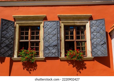 Facade Of Antique Historical Building. Windows With Flowers. Lviv, Ukraine. European Travel Photo.