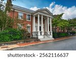 Facade of a building at the Harvard University, in Cambridge, Massachusetts. Sunny summer day.