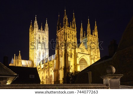 Facade of Canterbury Cathedral illuminated at night, one of the oldest and most important Christian sites in England