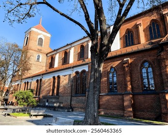 Facade of Cathedral Basilica of apostles St. Peter and St. Paul of Kaunas. Inside of the largest Gothic church in Lithuania built in gothic and neo-gothic style with renaissance features. - Powered by Shutterstock