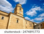 Facade of the church of the Assumption in Hellín, Albacete, Castilla-La Mancha, Spain with the bell tower as the protagonist