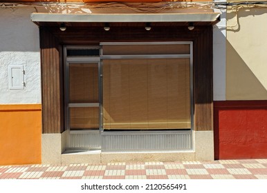 Facade of a closed shop with a design in the style of the seventies of the 20th century, Spain  - Shutterstock ID 2120565491