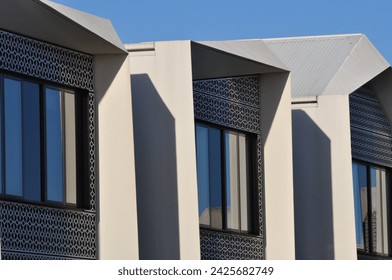 facade of complex housing with the evening sun in profile