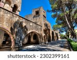 The facade of a dilapidated, abandoned house, the Eleousa Sanatorium on the Greek island of Crete