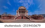 Facade and front staircase of the imposing Amazonas Theater in the city of Manaus on a day with blue skies and few clouds. Symbol of the golden period of the rubber cycle in Brazil