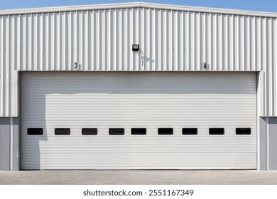 Facade (front view) of warehouse lined with a metal profile