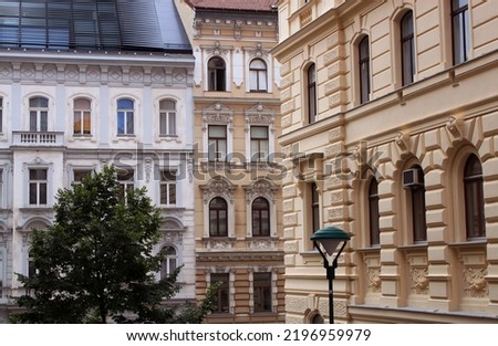 Facade of historical buildings in the old town of Vienna, Austria, Central Europe. Exterior view of heritage houses. Statues, sculptures, figures, ornaments, architectural background.