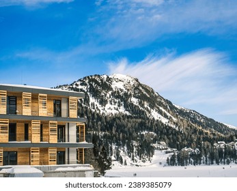 Facade of a hotel with balconies in a ski resort, winter, alps, mountain peak, Carinthia, Austria