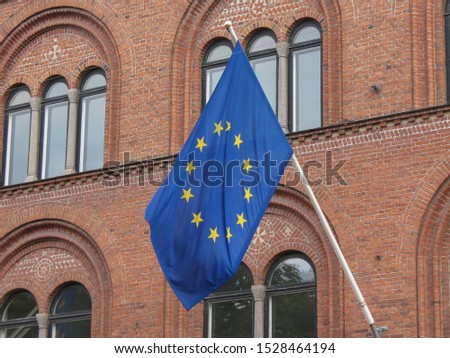 facade of the main railway station in Helsingor, Denmark, with EU flag