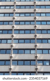 Facade of massive building with closed windows. Concept of city repetitive pattern as a background.