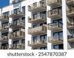 The facade of a modern apartment building with balconies seen in Berlin