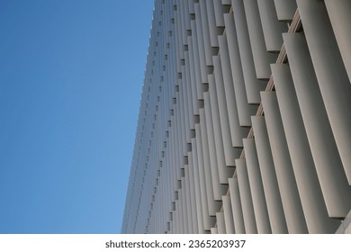 facade of a modern buiding with brise soleil sun shades.