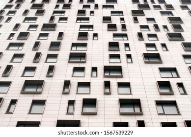 Facade of modern building with irregular window placement