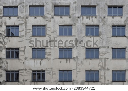 Facade of a modern building with windows and blinds. Background