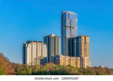 Facade Of Modern High End Luxury Apartments In Austin Texas Against Blue Sky. Modern Housing Concept With View Of Residential Building Exterior On A Sunny Day.