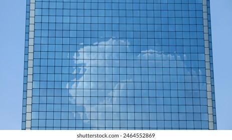 Facade of a modern high-rise building with blue glass windows. - Powered by Shutterstock