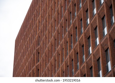 The Facade Of A Modern House Made Of Red Clinker Brick With Panoramic Windows Close-up  